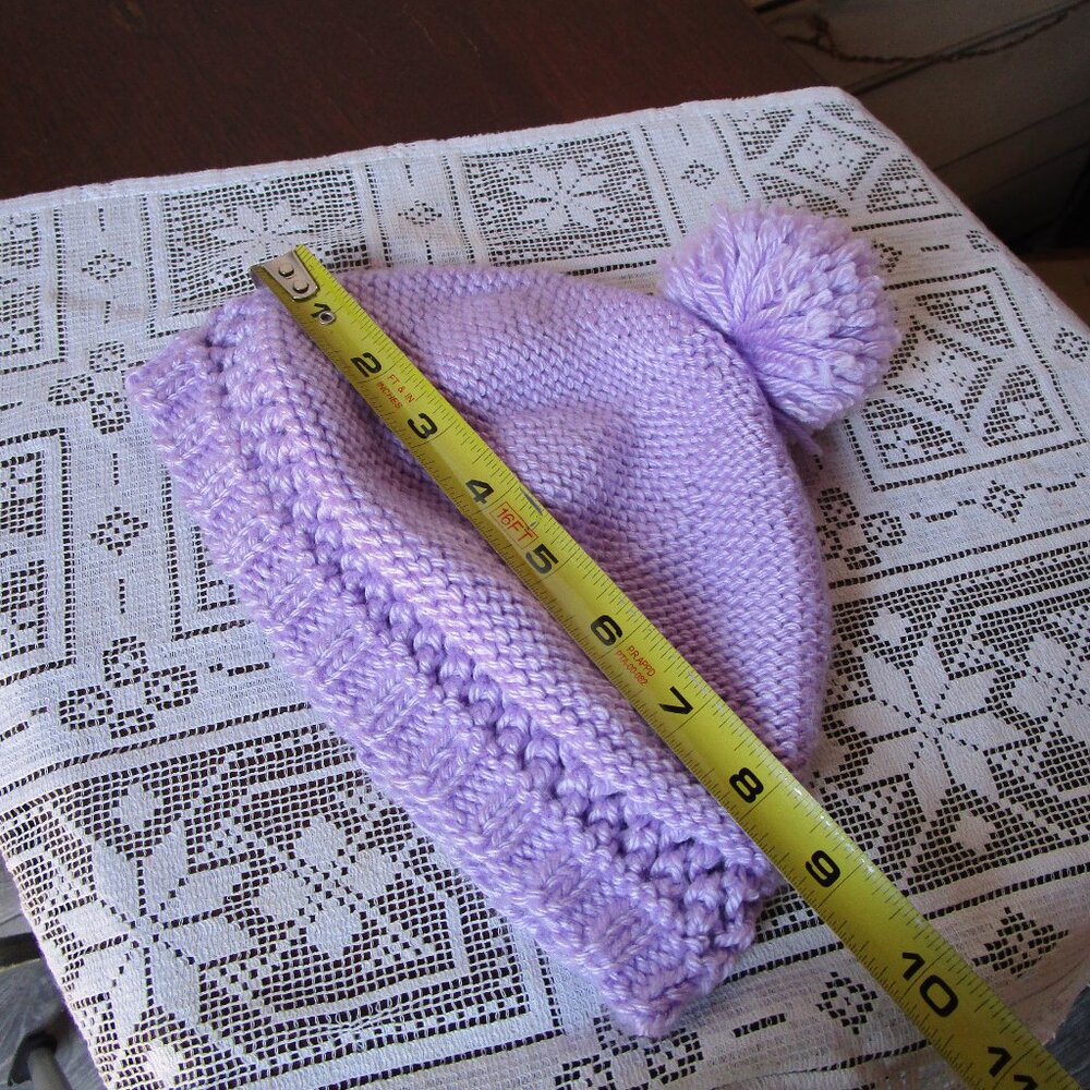 Lavendar yarn knit cap with 2 inch pom-pom on top. Kids snow hat.